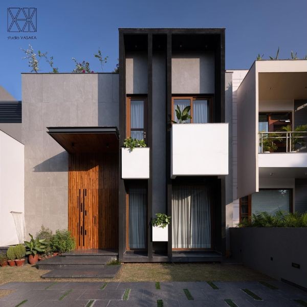 Rumah Minimalis 2 Lantai Kombinasi Material Kaca dan Beton